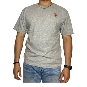 Champion with embroidered rose and broken shirt